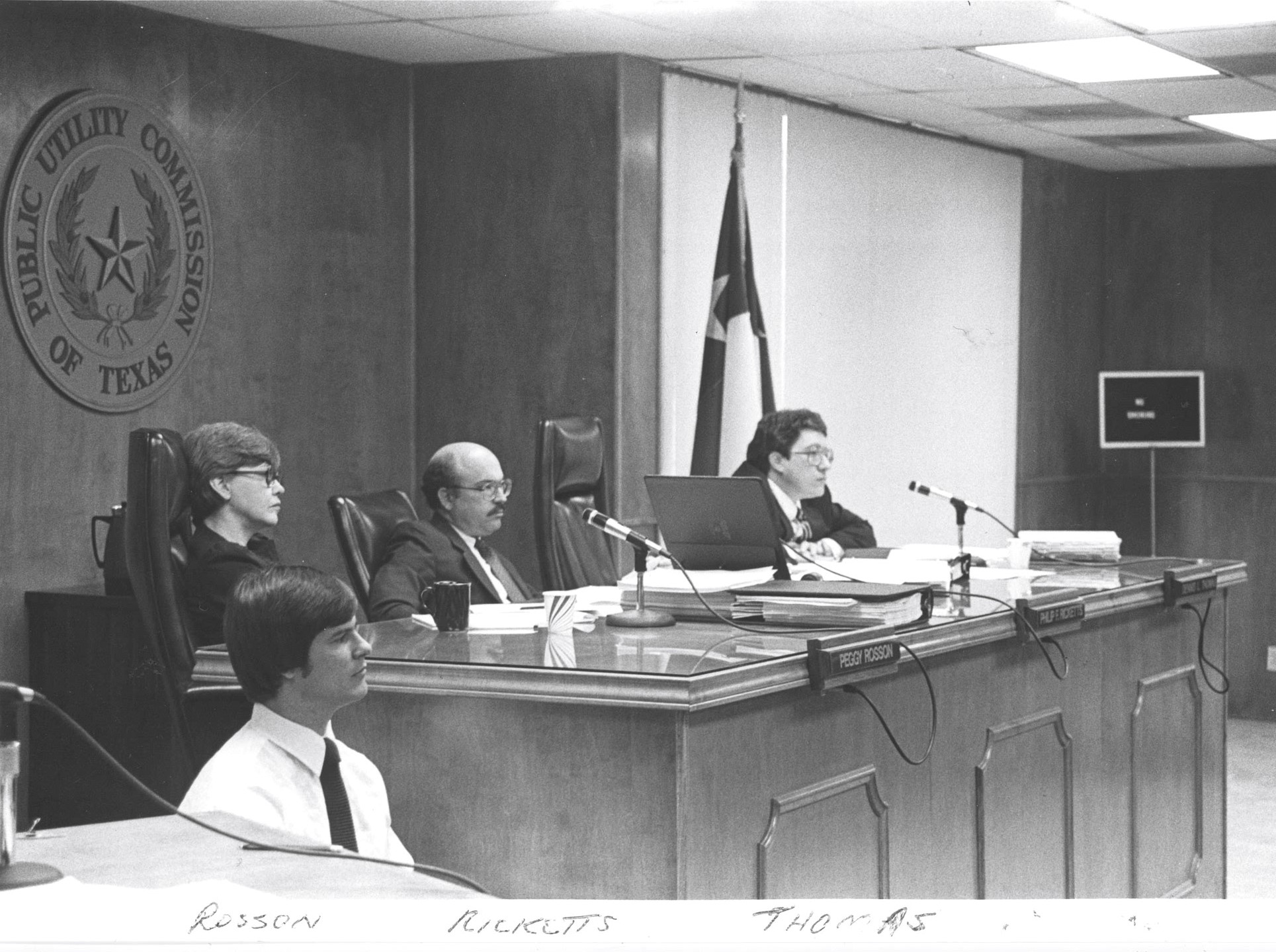 PUCT commissioners hold an open meeting in the Commissioners' Hearing Room at the Shoal Creek HQ.