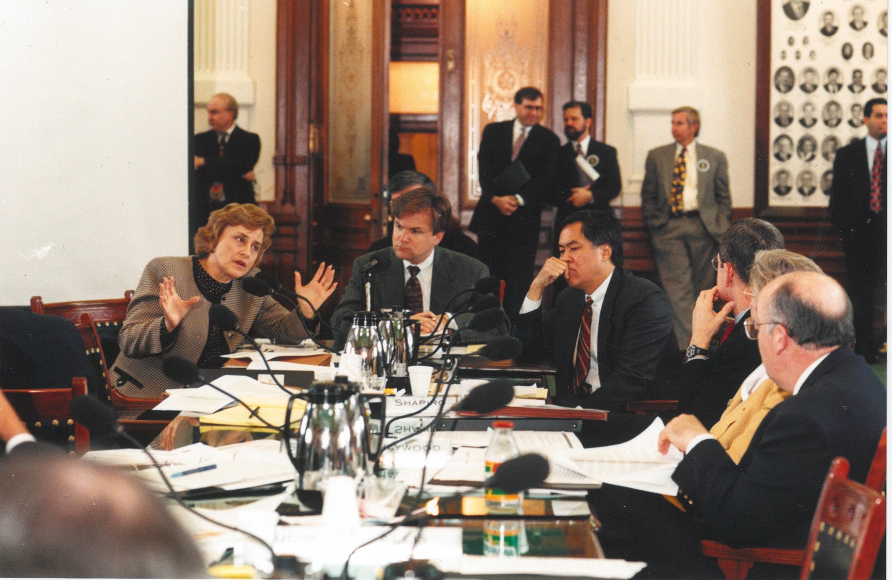 PUCT commissioners testifying before the Texas Senate Committee on XXXX about stranded costs for electric utilities.