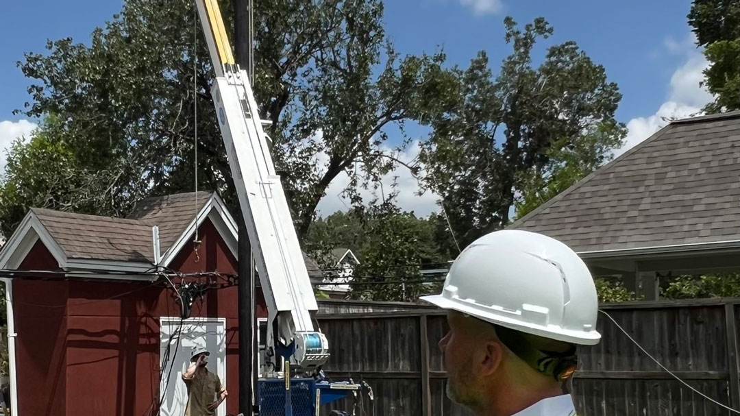 PUCT Chairman Thomas Gleeson surveying Hurricane Beryl recovery of power poles and lines in Houston.